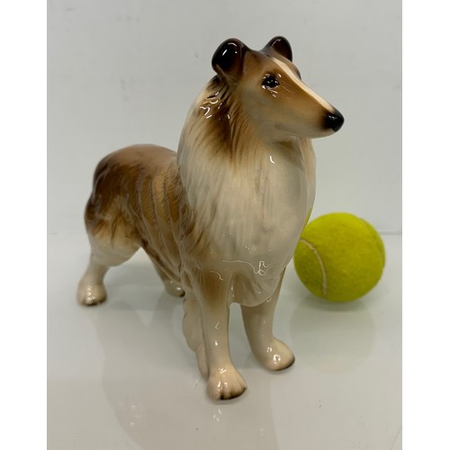 154 - Two ceramic dog figurines, a collie and a spaniel, Beswick?

This lot is available for in-house ship... 