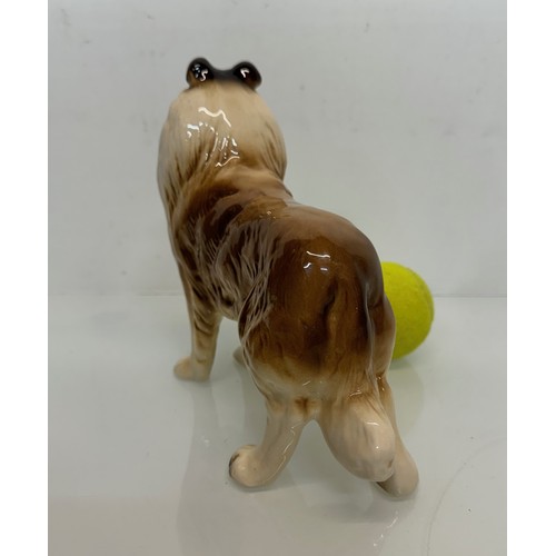 154 - Two ceramic dog figurines, a collie and a spaniel, Beswick?

This lot is available for in-house ship... 