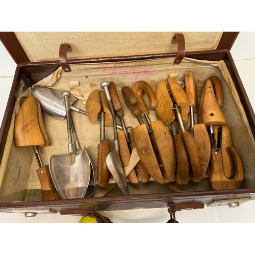 156 - Leather suitcase full with a collection of wooden and metal shoe lasts.

This lot is available for i... 