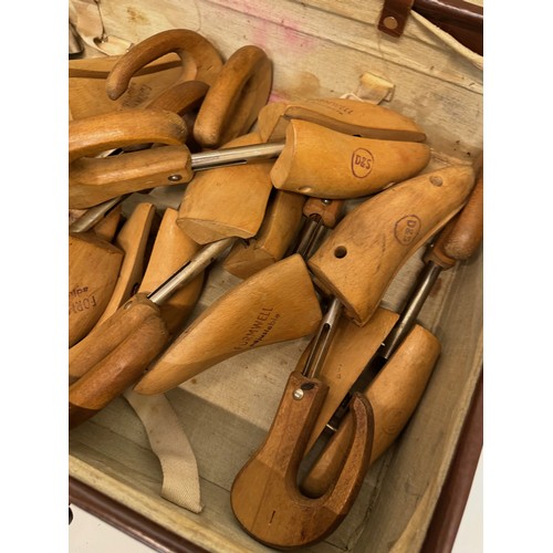 156 - Leather suitcase full with a collection of wooden and metal shoe lasts.

This lot is available for i... 