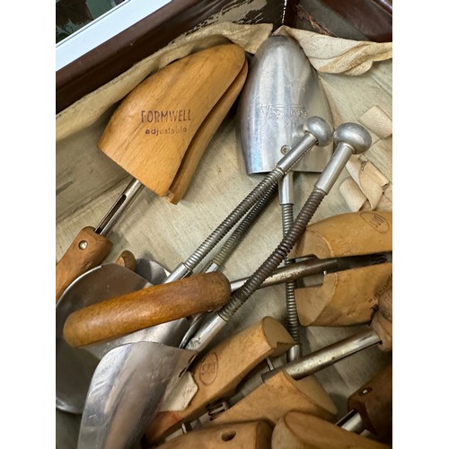 156 - Leather suitcase full with a collection of wooden and metal shoe lasts.

This lot is available for i... 