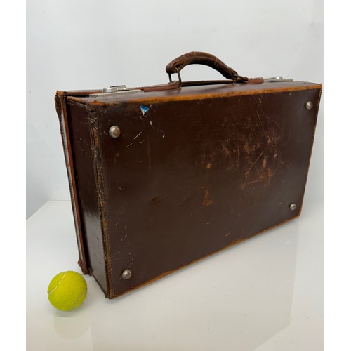 156 - Leather suitcase full with a collection of wooden and metal shoe lasts.

This lot is available for i... 