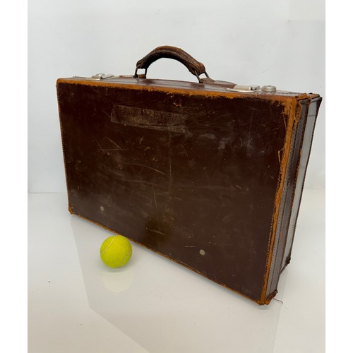 156 - Leather suitcase full with a collection of wooden and metal shoe lasts.

This lot is available for i... 