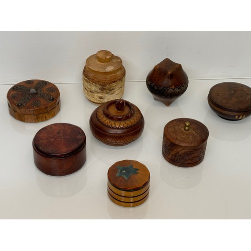 161 - Decorative treen storage pots, 8 in all.

This lot is available for in-house shipping