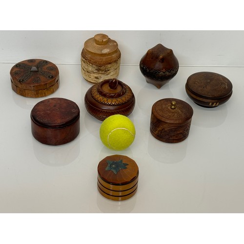 161 - Decorative treen storage pots, 8 in all.

This lot is available for in-house shipping