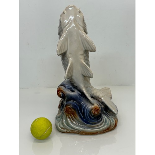 165 - Ceramic figurine of a carp, 40 cm tall.

This lot is available for in-house shipping