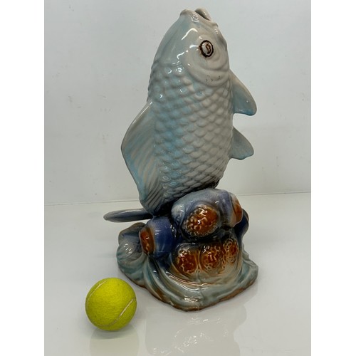 165 - Ceramic figurine of a carp, 40 cm tall.

This lot is available for in-house shipping