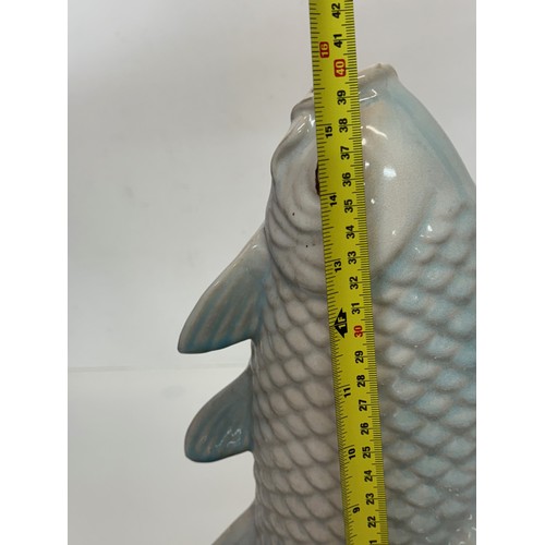 165 - Ceramic figurine of a carp, 40 cm tall.

This lot is available for in-house shipping