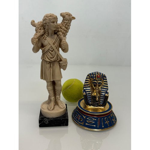 170 - Tutankhamun golden mask figurine and classical figure of a shepherd 23 cm tall.

This lot is availab... 