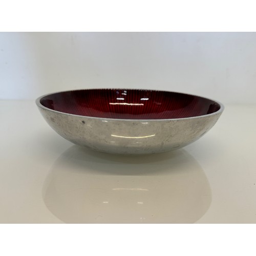 54 - Mid Century modern, textured aluminium bowl with candy red enamelling to the interior.

This lot is ... 