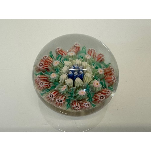 130 - Glass paper weight with domed internal decoration. 6 cm in dia.

This lot is available for in-house ... 