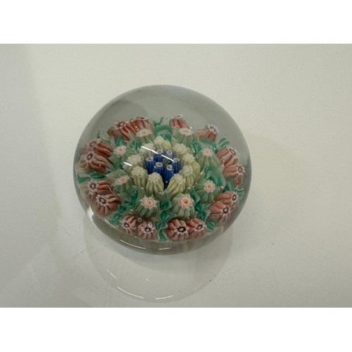 130 - Glass paper weight with domed internal decoration. 6 cm in dia.

This lot is available for in-house ... 