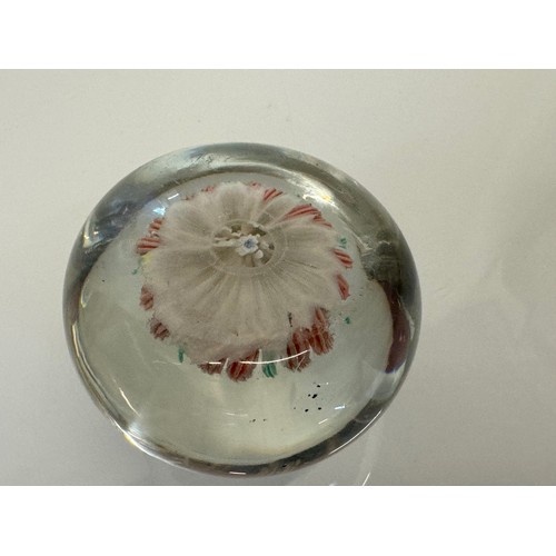 130 - Glass paper weight with domed internal decoration. 6 cm in dia.

This lot is available for in-house ... 