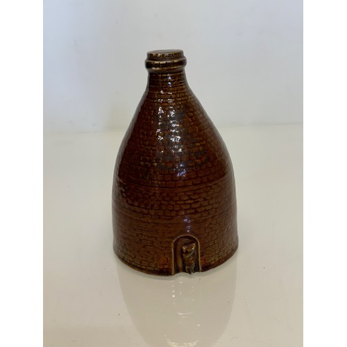 132 - Studio art pottery moneybox, a ceramic money box in the form of a brick kiln. 15 cm high.

This lot ... 