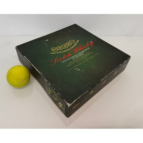 134 - Scotch Whisky, a whisky themed games compendium with five unopened bottles.

This lot is available f... 