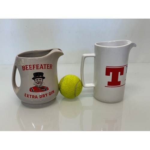 137 - Breweryana, advertising ceramics, two branded water jugs by Wade, Beefeater Gin and Tennants Lager.
... 