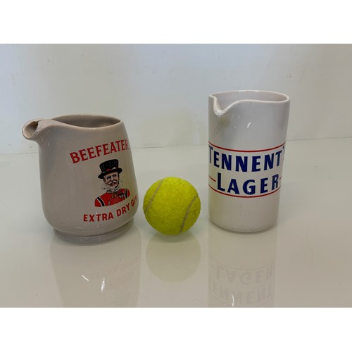 137 - Breweryana, advertising ceramics, two branded water jugs by Wade, Beefeater Gin and Tennants Lager.
... 