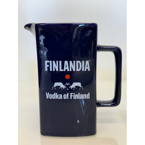 138 - Breweryana, advertising ceramics, two branded water jugs by Wade, Finlandia Vodka and Dunhill Intern... 