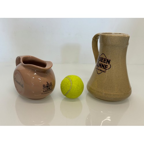 140 - Breweryana, advertising ceramics, two branded water jugs by Wade, Crawfords Whisky and Queen Anne Wh... 