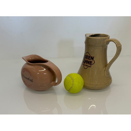 140 - Breweryana, advertising ceramics, two branded water jugs by Wade, Crawfords Whisky and Queen Anne Wh... 