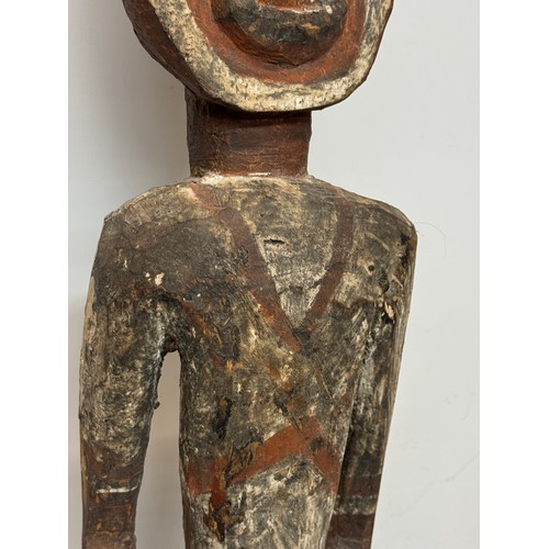 4 - Tribal art, hand carved and painted a large figure from New Guinea, 96 cm tall.

This lot is availab... 