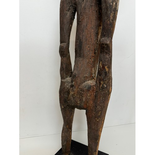 4 - Tribal art, hand carved and painted a large figure from New Guinea, 96 cm tall.

This lot is availab... 