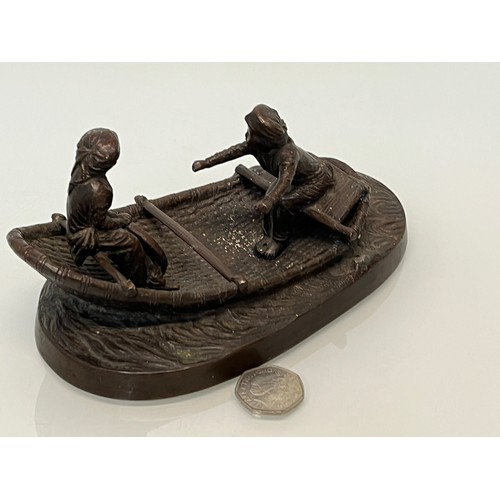 228 - Cast bronze of two oriental figures in a rowing boat as found without the oars. 19 cm x 11 cm x 9 cm... 