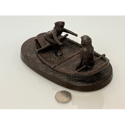 228 - Cast bronze of two oriental figures in a rowing boat as found without the oars. 19 cm x 11 cm x 9 cm... 