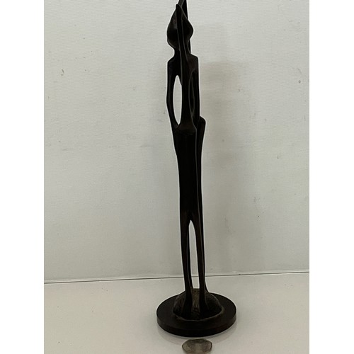 232 - A hand carved hard wood African sculpture of a couple.

This lot is available for in-house shipping