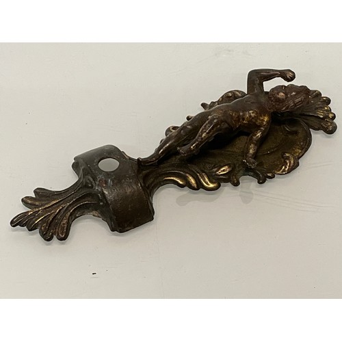 233 - A pair of cast furniture embellishments with cast in Cherub figures, each is 18 cm long.

This lot i... 