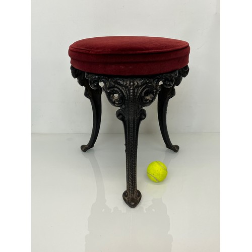 235 - A Victorian upholstered stool with cast iron legs, 43 cm high and 34 cm in diameter.

This lot is co... 