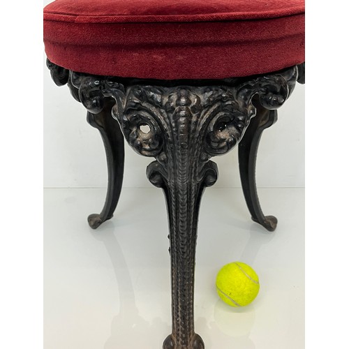 235 - A Victorian upholstered stool with cast iron legs, 43 cm high and 34 cm in diameter.

This lot is co... 