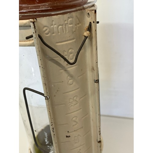 348 - Industrial, scientific glass, a measuring flask in a painted steel support.

This lot is available f... 