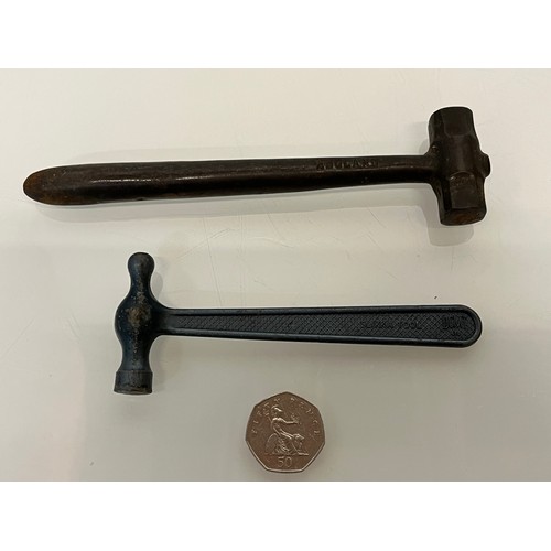 364 - Two cast metal toffee hammers.

This lot is available for in-house shipping