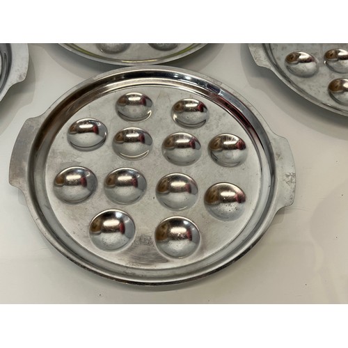 374 - Twelve stainless steel serving plates.

This lot is available for in-house shipping