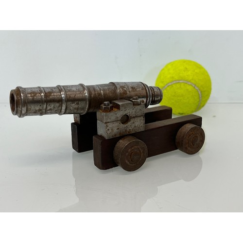 375 - Model cannon, with a turned barrel on a wooden carrage.

This lot is available for in-house shipping... 