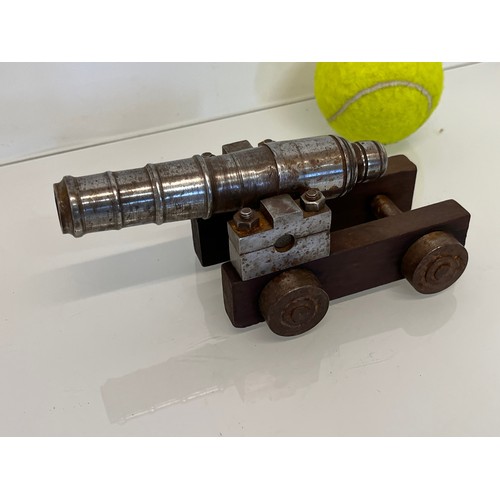 375 - Model cannon, with a turned barrel on a wooden carrage.

This lot is available for in-house shipping... 