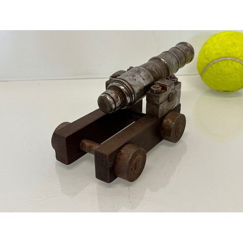 375 - Model cannon, with a turned barrel on a wooden carrage.

This lot is available for in-house shipping... 