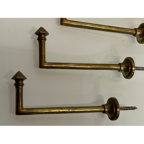 263 - Decorative fittings, Four brass art deco design tie backs, 11 cm long when mounted.

This lot is ava... 