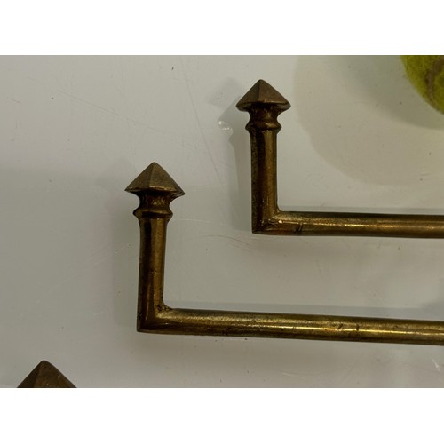 263 - Decorative fittings, Four brass art deco design tie backs, 11 cm long when mounted.

This lot is ava... 