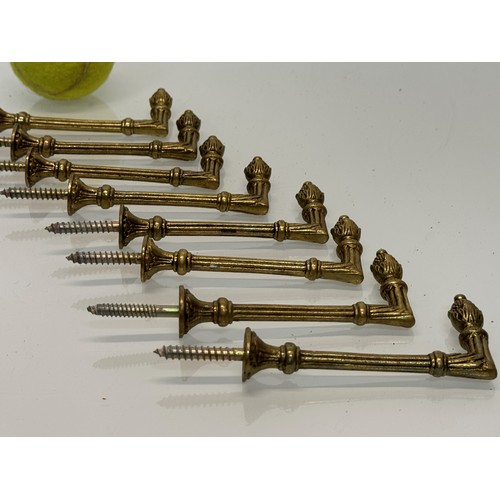 264 - Decorative fittings, eight brass classically designed tie backs, 10 cm long when mounted.

This lot ... 