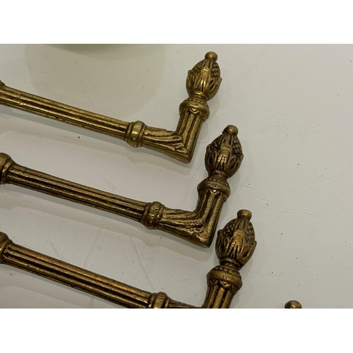 264 - Decorative fittings, eight brass classically designed tie backs, 10 cm long when mounted.

This lot ... 