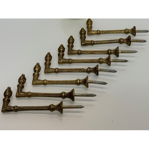 264 - Decorative fittings, eight brass classically designed tie backs, 10 cm long when mounted.

This lot ... 