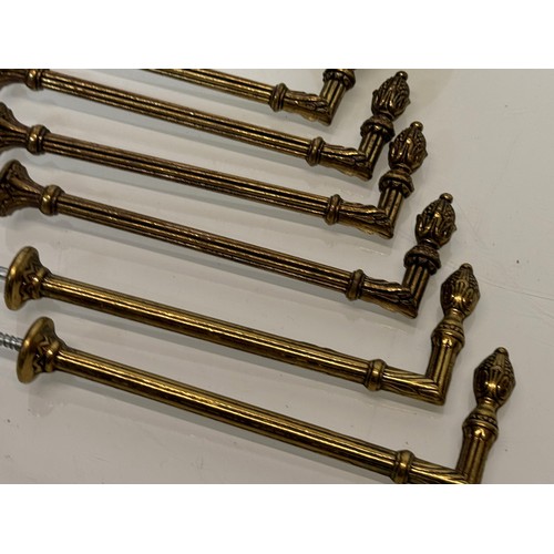 265 - Decorative fittings, six brass classical design tie backs, 15 cm long when mounted.

This lot is ava... 