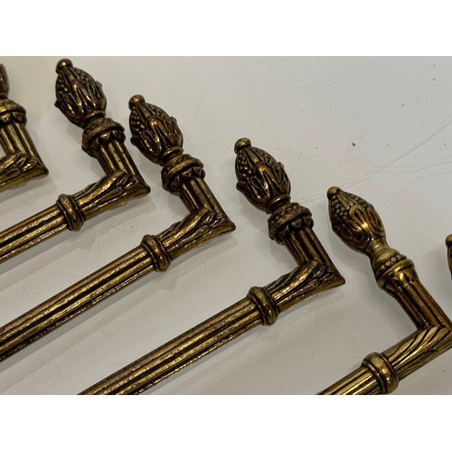 265 - Decorative fittings, six brass classical design tie backs, 15 cm long when mounted.

This lot is ava... 