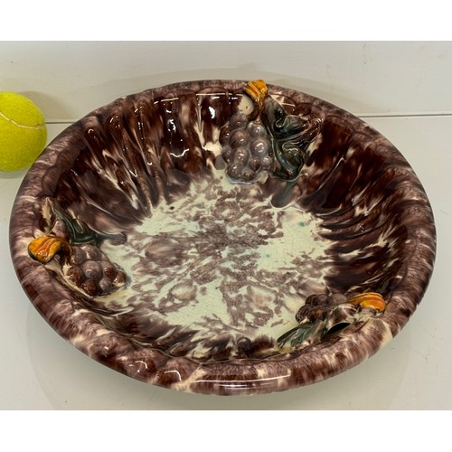 274 - Kitcsh mid century German studio pottery bowl decorated with grapes, 31 cm diameter.

This lot is av... 