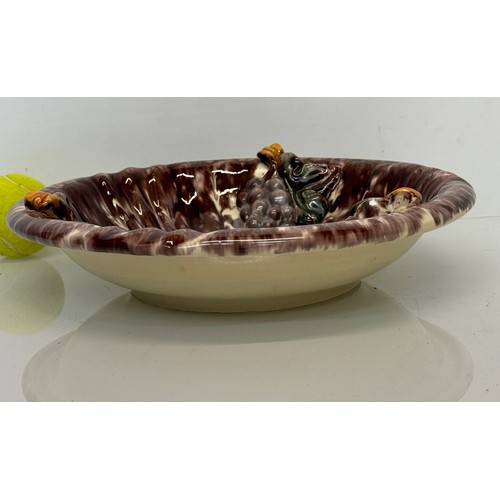 274 - Kitcsh mid century German studio pottery bowl decorated with grapes, 31 cm diameter.

This lot is av... 