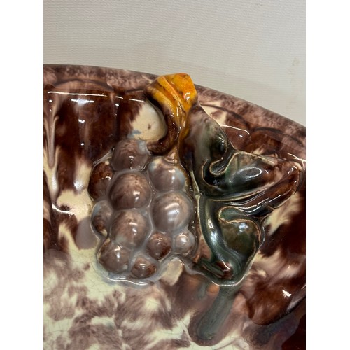 274 - Kitcsh mid century German studio pottery bowl decorated with grapes, 31 cm diameter.

This lot is av... 