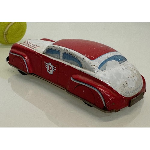 278 - Toys, automobilia, a vintage German US Zone tin plate police car with friction drive., 15 cm long.

... 