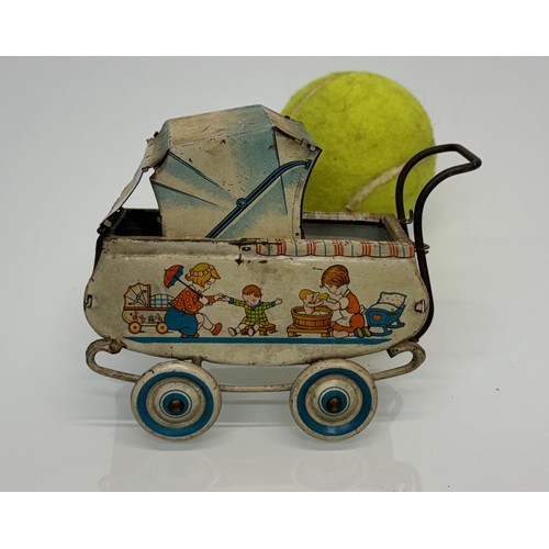 288 - Toys, lithographed tin plate German pram..

This lot is available for in-house shipping